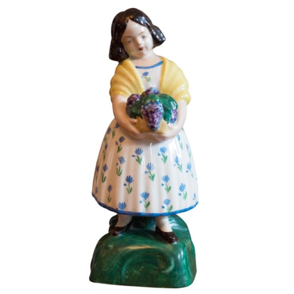 statuette of a young girl with flowers